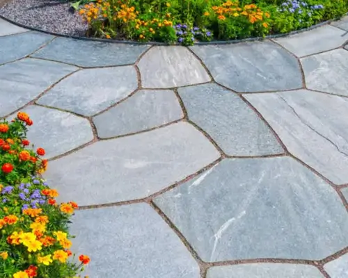 Professional hardscaping services with stone patio and walkway design