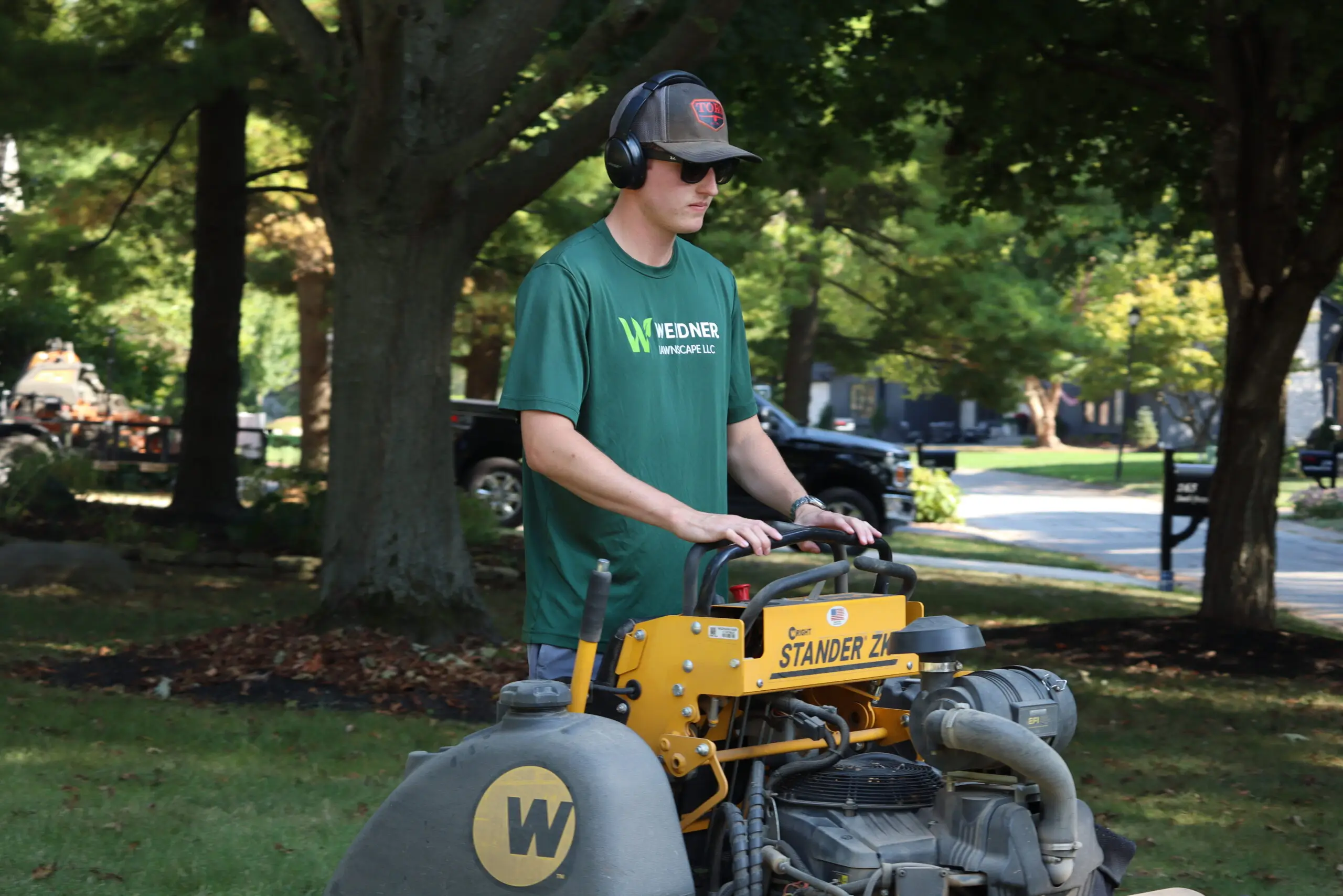 Professional lawn mowing service maintaining a lush green yard